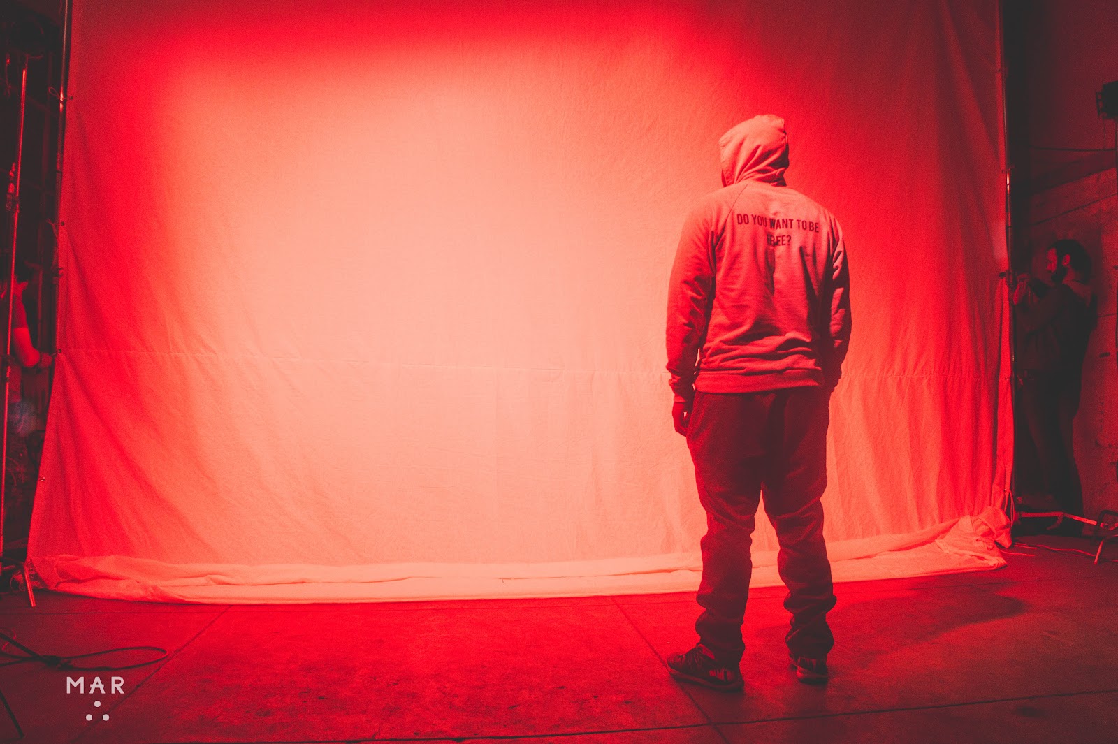 Documentary photograph of a hip hop artist mid-performance