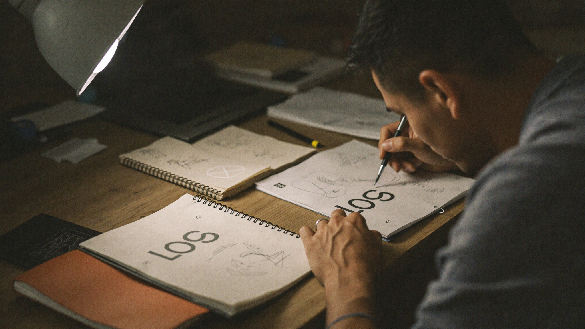 Mar White working closely on a single logo design at his desk